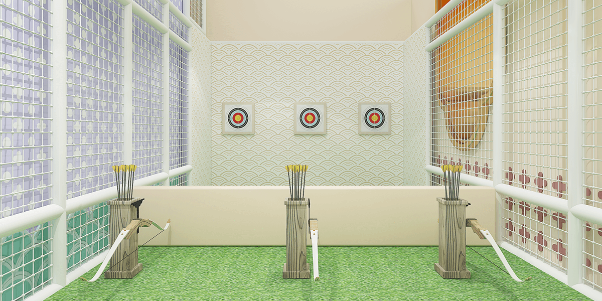 Indoor archery area with three targets, bow and arrows in wooden stands, and a grassy floor surrounded by protective mesh.