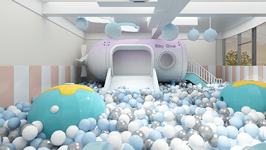 Bright play area with a large purple slide, colorful ball pit, and floating decorative balls.