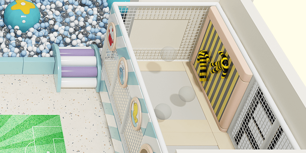 Overhead view of a play area with a ball pit, colorful slides, interactive panels, and a striped bumblebee play structure.